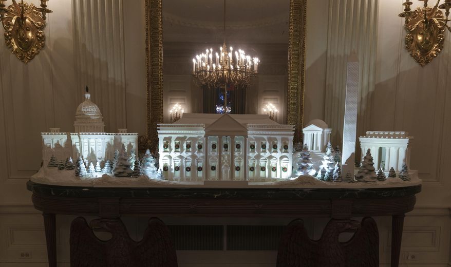 FILE - In this Nov. 26, 2018 file photo, the gingerbread house, showcasing the full expanse of the National Mall: the Capitol, the Lincoln Memorial, the Jefferson Memorial, the Washington Monument, and, the White House is seen in the State Dining Room during the 2018 Christmas Press Preview at the White House in Washington. The theme of this year’s White House holiday decor, revealed by the first lady this week, is “American Treasures,” The Associated Press reported. It is not “Christmas Traditions,” as claimed in a social media post. One element that is significantly different this year is the traditional White House gingerbread house, which is a massive, sugary replica of the entire National Mall. (AP Photo/Carolyn Kaster, File)