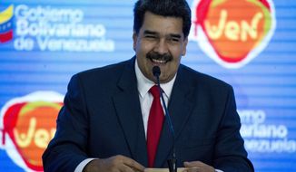 Venezuela&#39;s President Nicolas Maduro smiles as he speaks at the closing ceremony of the International Tourism Fair in Caracas, Venezuela, Monday, Nov. 26,2018. The United Nations has released $9.2 million for food, medicine and other help for struggling Venezuelans through an emergency relief fund, the first such assistance during the country&#39;s deepening a political and economic crisis. (AP Photo/Ariana Cubillos)