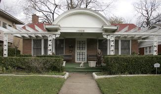 This Nov. 20, 2009 photo shows the exterior of home that has served as a rooming house where Lee Harvey Oswald lived before President John F. Kennedy was assassinated on Nov. 22, 1963. (Jen Friedberg/The Dallas Morning News via AP)