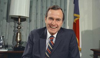 FILE - In this Dec. 18, 1970, file photo, newly appointed United Nations Ambassador George H. Bush smiles. Bush has died at age 94. Family spokesman Jim McGrath says Bush died shortly after 10 p.m. Friday, Nov. 30, 2018, about eight months after the death of his wife, Barbara Bush. (AP Photo/John Duricka, File)