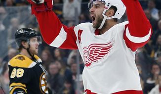 Detroit Red Wings&#39; Frans Nielsen celebrates his go-ahead goal during the third period of an NHL hockey game against the Boston Bruins in Boston, Saturday, Dec. 1, 2018. (AP Photo/Michael Dwyer)