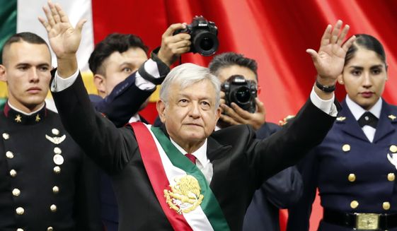 Mexico&#39;s new President Andres Manuel Lopez Obrador greets the crowd at the end of his inaugural ceremony at the National Congress in Mexico City, Saturday, Dec. 1, 2018. Mexicans are getting more than just a new president Saturday. The inauguration of Lopez Obrador will mark a turning point in one of the world&#39;s most radical experiments in opening markets and privatization. (AP Photo/Eduardo Verdugo)