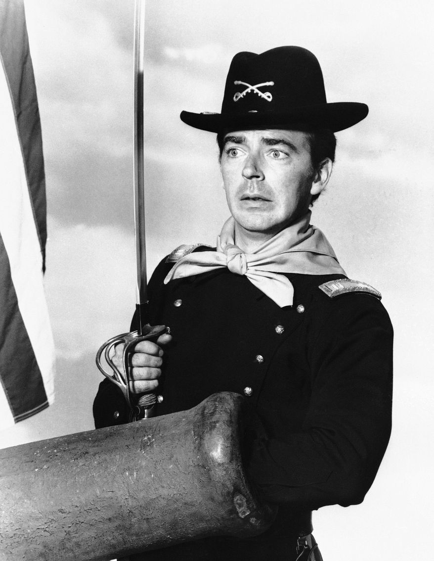 Ken Berry, who plays Captain Wilton Parmenter in an upcoming TV series called "F Troop," reaches down the wrong end of cannon in one of the show's episodes, July 1, 1965. Parmenter was promoted from private to captain for leading an unplanned charge in the wrong direction toward the enemy. The new series deals with a strange and comical cavalry troop on the American frontier. (AP Photo)