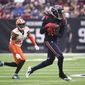 Houston Texans wide receiver DeAndre Hopkins (10) makes a catch in front of Cleveland Browns strong safety Damarious Randall (23) during the first half of an NFL football game, Sunday, Dec. 2, 2018, in Houston. (AP Photo/Eric Christian Smith)
