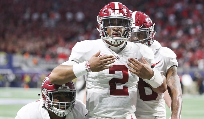 Alabama quarterback Jalen Hurts (2) celebrates after scoring the during the fourth quarter against Georgia during an NCAA college football game for the Southeastern Conference championship Saturday, Dec. 1, 2018, in Atlanta. (AJ ReynoldsAthens Banner-Herald via AP) ** FILE **