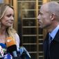 Adult film actress Stormy Daniels, left, stands with her lawyer, Michael Avenatti, after speaking outside federal court in New York on April 16, 2018. (AP Photo/Mary Altaffer)