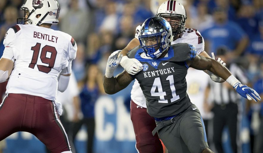 FILE - In this Sept. 29, 2018, file photo, Kentucky linebacker Josh Allen (41) rushes South Carolina quarterback Jake Bentley (19) during the second half of an NCAA college football game in Lexington, Ky. Allen is the defensive player of the year on The Associated Press All-Southeastern Conference team, announced Monday, Dec. 3, 2018. (AP Photo/Bryan Woolston, File)