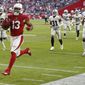 FILE - In this Nov. 18, 2018, file photo, Arizona Cardinals wide receiver Christian Kirk (13) runs for a touchdown after a catch against the Oakland Raiders during the first half of an NFL football game in Glendale, Ariz. Kirk broke a foot in a game Sunday, Dec. 2, 2018, at Green Bay and is out for the season. (AP Photo/Ross D. Franklin, File)