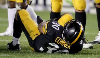 Pittsburgh Steelers running back James Conner (30) is injured after being tackled by Los Angeles Chargers defensive back Adrian Phillips in the second half of an NFL football game, Sunday, Dec. 2, 2018, in Pittsburgh. (AP Photo/Gene J. Puskar)