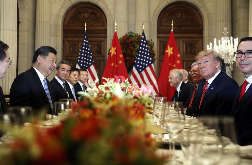 FILE - In this Dec. 1, 2018, file photo, U.S. President Donald Trump, second right, and China's President Xi Jinping, second left, attend their bilateral meeting at the G20 Summit in Buenos Aires, Argentina. A U.S.-Chinese cease fire on tariffs gives jittery companies a respite but does little to resolve a war over Beijing's technology ambitions that threatens to chill global economic growth. (AP Photo/Pablo Martinez Monsivais, File) **FILE**