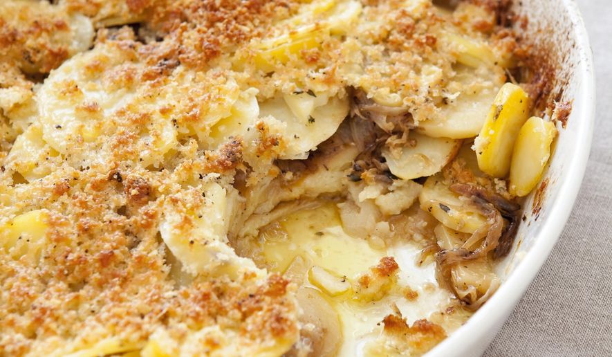 This undated photo provided by America's Test Kitchen in November 2018 shows potato gratin in Brookline, Mass. (Joe KellerAmerica's Test Kitchen via AP)