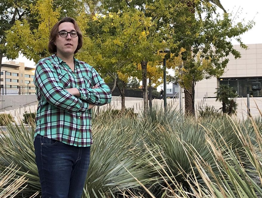 Journalist Emma Best poses for a photograph in Las Vegas on Tuesday, Nov. 27, 2018. Best serves as de facto spokesperson for a new leak website called Distributed Denial of Secrets; her online library’s struggle with what leaks to keep on its shelves is illustrating the difficulty of balancing full transparency with respect for privacy in an age of mass disclosures. (AP Photo/Regina Garcia Cano)