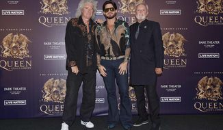FILE - In this Aug. 28, 2018, file photo, Brian May, from left, Adam Lambert, and Roger Taylor of Queen + Adam Lambert pose for a photo at the &amp;quot;The Crown Jewels&amp;quot; residency press conference at the MGM Resorts aviation hanger in Las Vegas. Queen and Adam Lambert are launching a six-week North America tour following the release of the Freddie Mercury biopic “Bohemian Rhapsody.” Live Nation announced Monday, Dec. 3, the 23-date tour, featuring original band members May and Taylor, will kick off in Vancouver, British Columbia, on July 10. (Photo by Al Powers/Powers Imagery/Invision/AP, File)