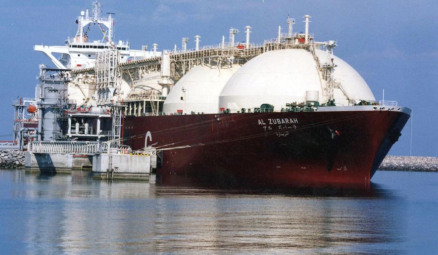 FILE - This undated file photo shows a Qatari liquid natural gas (LNG) tanker ship being loaded up with LNG at Raslaffans Sea Port, northern Qatar. The tiny, energy-rich Arab nation of Qatar announced on Monday, Dec. 3, 2018 it would withdraw from OPEC, mixing its aspirations to increase production outside of the cartel&#39;s constraints with the politics of slighting the Saudi-dominated group amid the kingdom&#39;s boycott of Doha. (AP Photo, File)