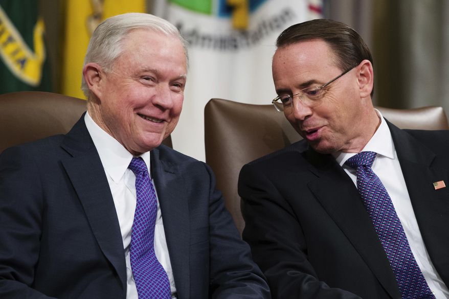 Then-Attorney General Jeff Sessions, left, and Deputy Attorney General Rod Rosenstein, talk during an event to announce new strategic actions to combat the opioid crisis at the Department of Justice's National Opioid Summit in Washington on Oct. 25, 2018. (AP Photo/Alex Brandon) ** FILE **