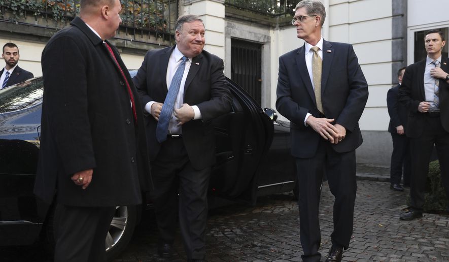 U.S. Secretary of State Mike Pompeo, second left, arrives for a meeting with Belgian Prime Minister Charles Michel in Brussels, Tuesday, Dec. 4, 2018. U.S. Secretary of State Mike Pompeo is in Brussels to attend a two-day meeting of NATO foreign ministers. (AP Photo/Francisco Seco, Pool)