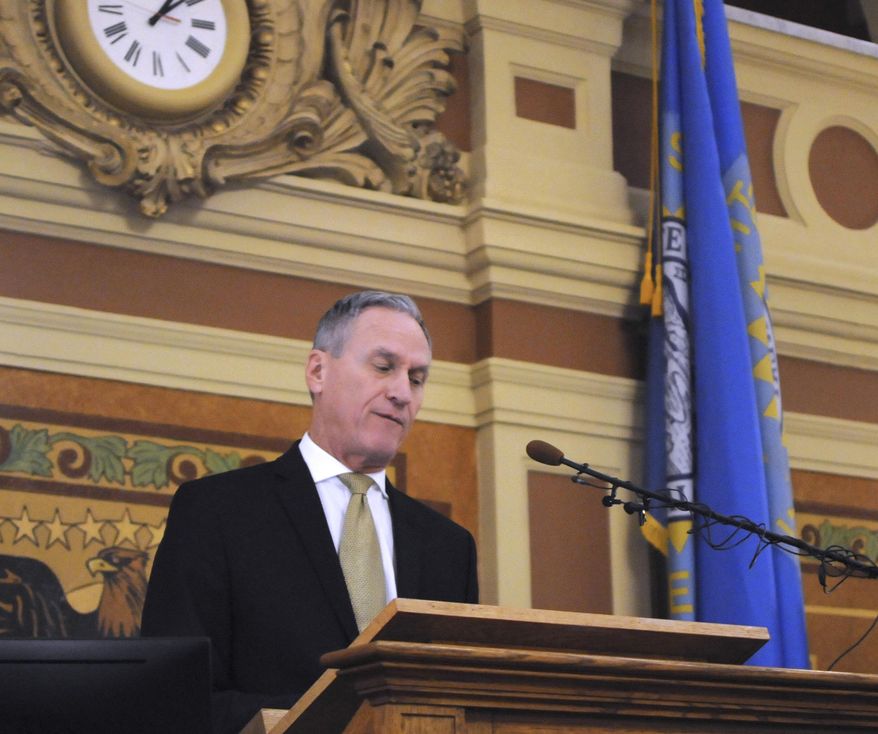 Gov. Dennis Daugaard gives the final budget address governor at the state Capitol in Pierre, S.D., Tuesday, Dec. 4, 2018. Daugaard is proposing spending increases for education, state employees and Medicaid providers in his plan. (AP Photo/James Nord)