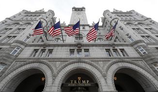 FILE - This Dec. 21, 2016 file photo shows the Trump International Hotel at 1100 Pennsylvania Avenue NW, in Washington. The attorneys general of the District of Columbia and Maryland plan to file subpoenas seeking records from the Trump Organization, the IRS and other entities in their lawsuit accusing Donald Trump of profiting off the presidency. (AP Photo/Alex Brandon, File)