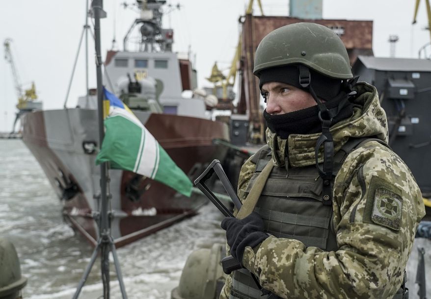 A Ukrainian serviceman stands on board a coast guard ship in the Sea of Azov port of Mariupol, eastern Ukraine, Monday, Dec. 3, 2018. The Ukrainian military has been on increased readiness as part of martial law introduced in the country in the wake of the Nov. 25, 2018, incident in the Sea of Azov, in which the Russian coast guard fired upon and seized three Ukrainian navy vessels along with their crews. (AP Photo/Evgeniy Maloletka) ** FILE **