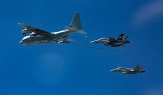 In this Oct. 13, 2016, photo provided by U.S. Marine Corps, two F/A-18D Hornets with Marine All-Weather Fighter Attack Squadron 533 approach a KC-130J with Marine Aerial Refueler Transport Squadron 352 during a Special Purpose Marine Air-Ground Task Force - Crisis Response - Central Command aerial refueling exercise in undisclosed location.  On Thursday, Dec. 6, 2018, two American warplanes crashed into the Pacific Ocean off Japan&#39;s southwestern coast after a midair collision,  and rescuers found one of the seven crew members in stable condition while searching for the others, officials said.  The U.S. Marine Corps said that the crash involved an F/A-18 fighter jet and a KC-130 refueling aircraft during regular training after the planes took off from their base in Iwakuni, near Hiroshima in western Japan.  (Cpl. Trever Statz/U.S. Marine Corps via AP)