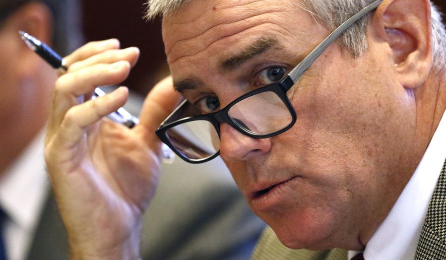 House Speaker Philip Gunn, R-Clinton, reviews the state budget recommendations for the coming year, before members of the Joint Legislative Budget Committee, Wednesday, Dec. 5, 2018, in Jackson, Miss. The committee adopted a broad outline for a $6.1 billion spending plan. (AP Photo/Rogelio V. Solis)