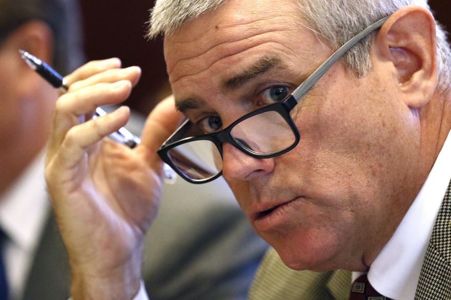 House Speaker Philip Gunn, R-Clinton, reviews the state budget recommendations for the coming year, before members of the Joint Legislative Budget Committee, Wednesday, Dec. 5, 2018, in Jackson, Miss. The committee adopted a broad outline for a $6.1 billion spending plan. (AP Photo/Rogelio V. Solis)