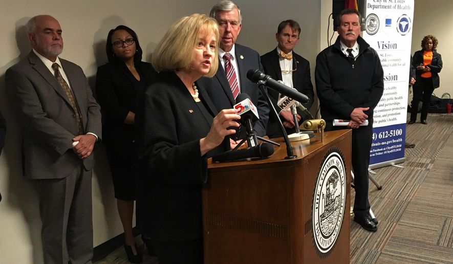 St. Louis Mayor Lyda Krewson speaks at a news conference in St. Louis on Wednesday, Dec. 5, 2018, with Missouri Gov. Mike Parsons and others looking on. Krewson and Parsons both are urging the Missouri Legislature to adopt a prescription drug monitoring plan to combat the opioid epidemic. (AP Photo/Jim Salter)