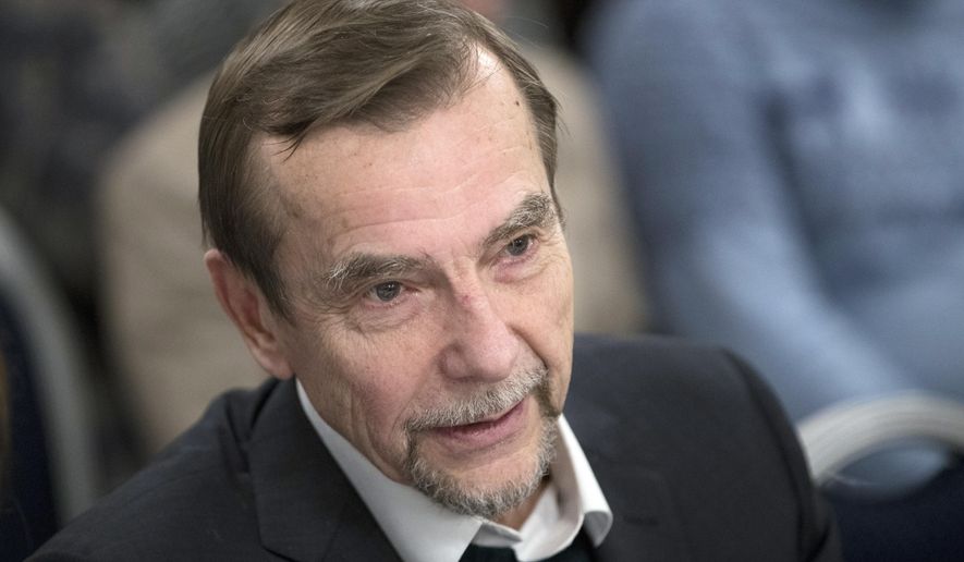 FILE- In this file photo taken on Monday, Dec. 12, 2016, Russian human rights activist Lev Ponomarev attends an annual meeting of opposition and human rights activists in Moscow, Russia . A court in Moscow has sentenced Ponomarev, a 77-year old human rights activist, to 25 days in jail for calling for an unauthorized protest, a ruling that has drawn strong criticism from campaigners. (AP Photo/Pavel Golovkin, File)
