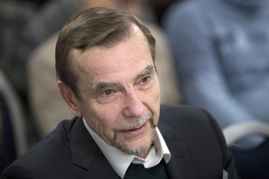 FILE- In this file photo taken on Monday, Dec. 12, 2016, Russian human rights activist Lev Ponomarev attends an annual meeting of opposition and human rights activists in Moscow, Russia . A court in Moscow has sentenced Ponomarev, a 77-year old human rights activist, to 25 days in jail for calling for an unauthorized protest, a ruling that has drawn strong criticism from campaigners. (AP Photo/Pavel Golovkin, File)