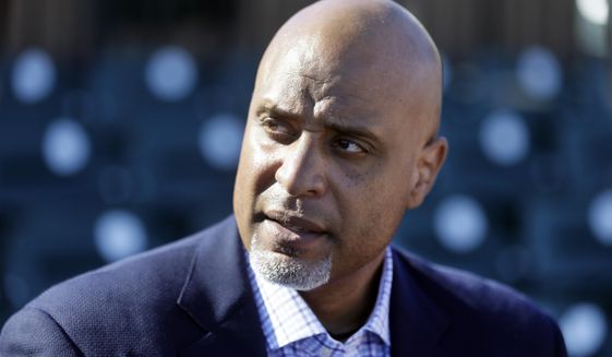 FILE - In this March 17, 2015, file photo, Major League Baseball Players Association executive director Tony Clark talks to the media before a spring training exhibition baseball game in Lakeland, Fla. Baseball players are concerned the Seattle Mariners have become yet another rebuilding team and may be joined by others. Union head Tony Clark and new collective bargaining director Bruce Meyer said Wednesday, Dec. 5, 2018 their members also are concerned about rapid change in the way games are played, such as the increased use of relief pitchers, and are willing to speak with management this offseason about whether counteracting changes are needed.(AP Photo/Carlos Osorio, File)