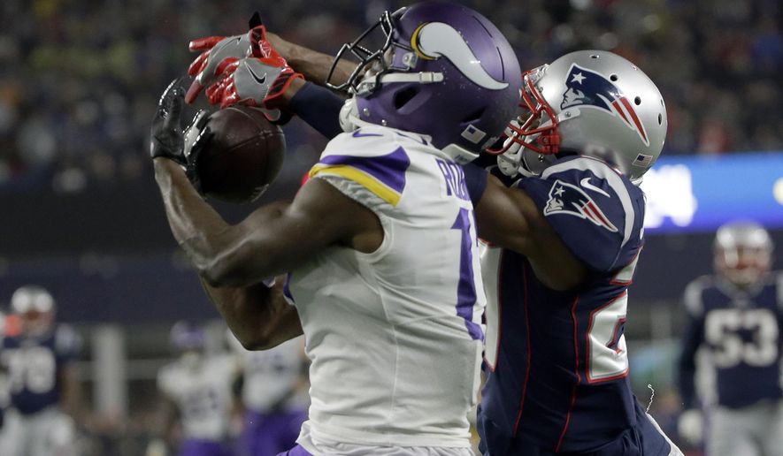 New England Patriots defensive back J.C. Jackson, right, breaks up a pass intended for Minnesota Vikings wide receiver Aldrick Robinson during the second half of an NFL football game, Sunday, Dec. 2, 2018, in Foxborough, Mass. (AP Photo/Steven Senne)