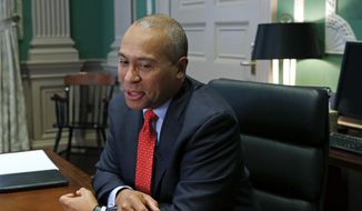In this Monday, Dec. 15, 2014, file photo, Massachusetts Gov. Deval Patrick speaks during an interview at his Statehouse office in Boston. (AP Photo/Elise Amendola) ** FILE **