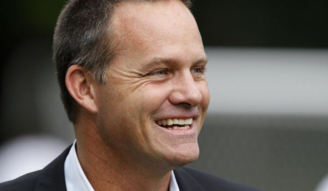 FILE - In this June 5, 2012, file photo, then-Cal FC head coach Eric Wynalda smiles before a U.S. Open Cup fourth-round soccer match against the Seattle Sounders, in Tukwila, Wash. Wynalda and Las Vegas Lights FC are running a job search unlike any other on the Strip at the moment. Not that you would expect anything less from the United Soccer League team that partnered with a marijuana dispensary, dropped $5,000 from a helicopter as part of a halftime promotion and embraced gambling like no American sports franchise ever before. (AP Photo/Elaine Thompson, File)