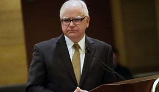 Minnesota Governor-elect Tim Walz takes questions about the state&#39;s budget forecast which was released Thursday, Dec. 6, 2018, in St. Paul, Minn. (AP Photo/Jim Mone)