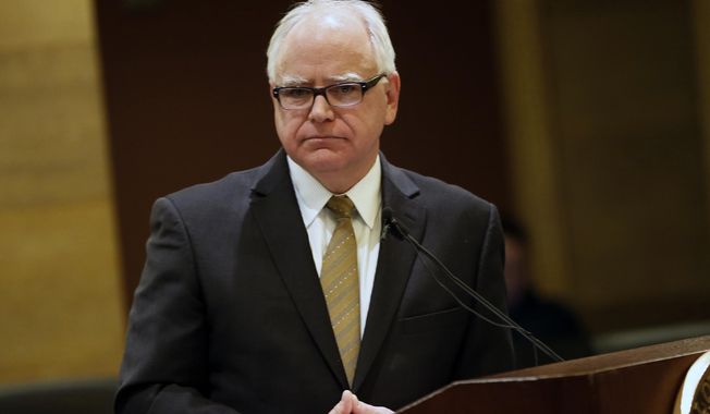 Minnesota Governor-elect Tim Walz takes questions about the state&#x27;s budget forecast which was released Thursday, Dec. 6, 2018, in St. Paul, Minn. (AP Photo/Jim Mone)