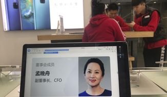 A profile of Huawei&#x27;s chief financial officer Meng Wanzhou is displayed on a Huawei computer at a Huawei store in Beijing, China, Thursday, Dec. 6, 2018. Canadian authorities said Wednesday that they have arrested Meng for possible extradition to the United States. (AP Photo/Ng Han Guan)
