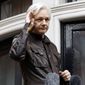 In this May 19, 2017 file photo, WikiLeaks founder Julian Assange greets supporters from a balcony of the Ecuadorian embassy in London. (AP Photo/Frank Augstein) **FILE**