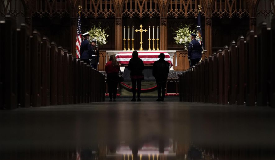 People pay their respects as former President George H.W. Bush lies in repose at St. Martin&#39;s Episcopal Church Wednesday, Dec. 5, 2018, in Houston. (AP Photo/David J. Phillip, Pool)