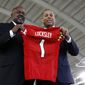 Maryland&#39;s new head football coach Mike Locksley, left, and athletic director Damon Evans pose during an NCAA college football news conference, Thursday, Dec. 6, 2018, in College Park, Md. Locksley, Alabama&#39;s offensive coordinator, will take over at Maryland after the most tumultuous year in the program&#39;s recent history. (AP Photo/Patrick Semansky) ** FILE **