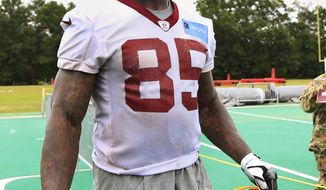 FILE - In this May 30, 2018, file photo, Washington Redskins tight end Vernon Davis (85) leaves the field following the NFL football team&#39;s full practice session at Redskins Park in Ashburn, Va. Veterans Julius Peppers, Von Miller and Vernon Davis are among the 32 nominees announced Thursday, Dec. 6, 2018, for the NFL&#39;s Walter Payton Man of the Year award. (AP Photo/Manuel Balce Ceneta, File)