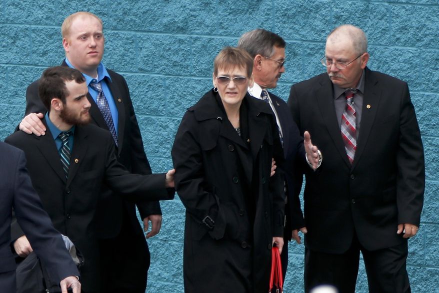 Family members of U.S. Air Force Staff Sgt. Dylan J. Elchin arrive for his memorial service on Thursday, Dec. 6, 2018, in Moon Township, Pa. Loney Duez, Elchin's stepfather, right, walks with Elchins mother Dawna Duez, center, along with brothers Aaron Elchin, second from left, and Zachery Bly, left. Elchin was one of three servicemen killed last month when their vehicle was destroyed by an improvised explosive device in Andar, in Afghanistan's Ghazni Province. (AP Photo/Keith Srakocic)