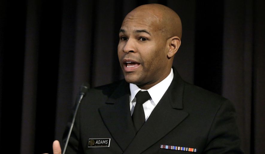 United States Surgeon General Jerome Adams addresses an audience during a national summit focused on police efforts to address the opioid epidemic, Thursday, Dec. 6, 2018, at Harvard Medical School in Boston. (AP Photo/Steven Senne)