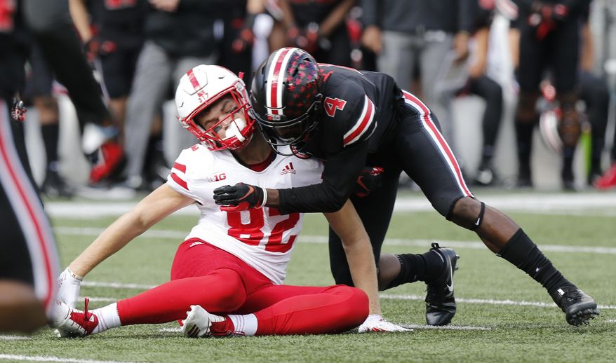 FILE - In this Nov. 3, 2018, file photo, Ohio State defensive back Jordan Fuller tackles Nebraska tight end Kurt Rafdal during the first half of an NCAA college football game Saturday, in Columbus, Ohio. Fuller was ejected from the game for a targeting penalty on the play. The NCAA says the number of enforced targeting penalties in the Football Bowl Subdivision this regular season was the same as in 2017. (AP Photo/Jay LaPrete, File)