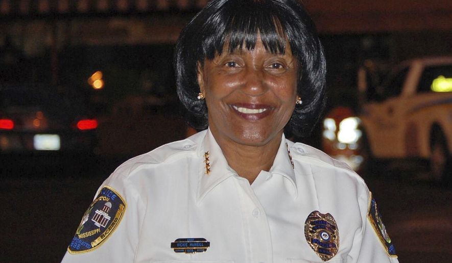 In this 2013 photo, former Canton, Miss., police chief Vickie McNeil smiles in Canton, Miss. McNeil is among six people indicted on accusations that they tried to influence a 2017 election in a central Mississippi city by improperly helping people fill out absentee ballots and voting despite being disqualified. (The Clarion-Ledger via AP)