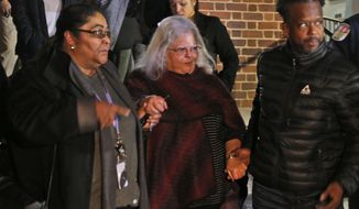 Susan Bro, center, mother of Heather Heyer, is escorted down the steps of the courthouse after a guilty verdict was reached in the trial of James Alex Fields Jr., Friday, Dec. 7, 2018, at Charlottesville General district court in Charlottesville, Va. Fields was convicted of first degree murder in the death of Heather Heyer as well as nine other counts during a &amp;quot;Unite the Right&amp;quot; rally in Charlottesville . (AP Photo/Steve Helber)