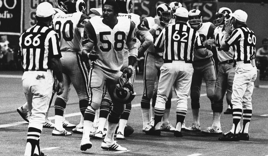FILE - In this Oct. 30, 1977, file photo, Los Angeles Rams linebacker Isiah Robertson (58) complains about a call during an NFL football game against the New Orleans Saints in New Orleans. Former two-time All-Pro linebacker Robertson was killed when the limousine he was driving skidded on a rain-slicked curve on a dark, rural East Texas highway and was hit by two other vehicles. The Texas Department of Public Safety reports the crash happened Thursday, Dec. 6, 2018. (AP Photo/File)