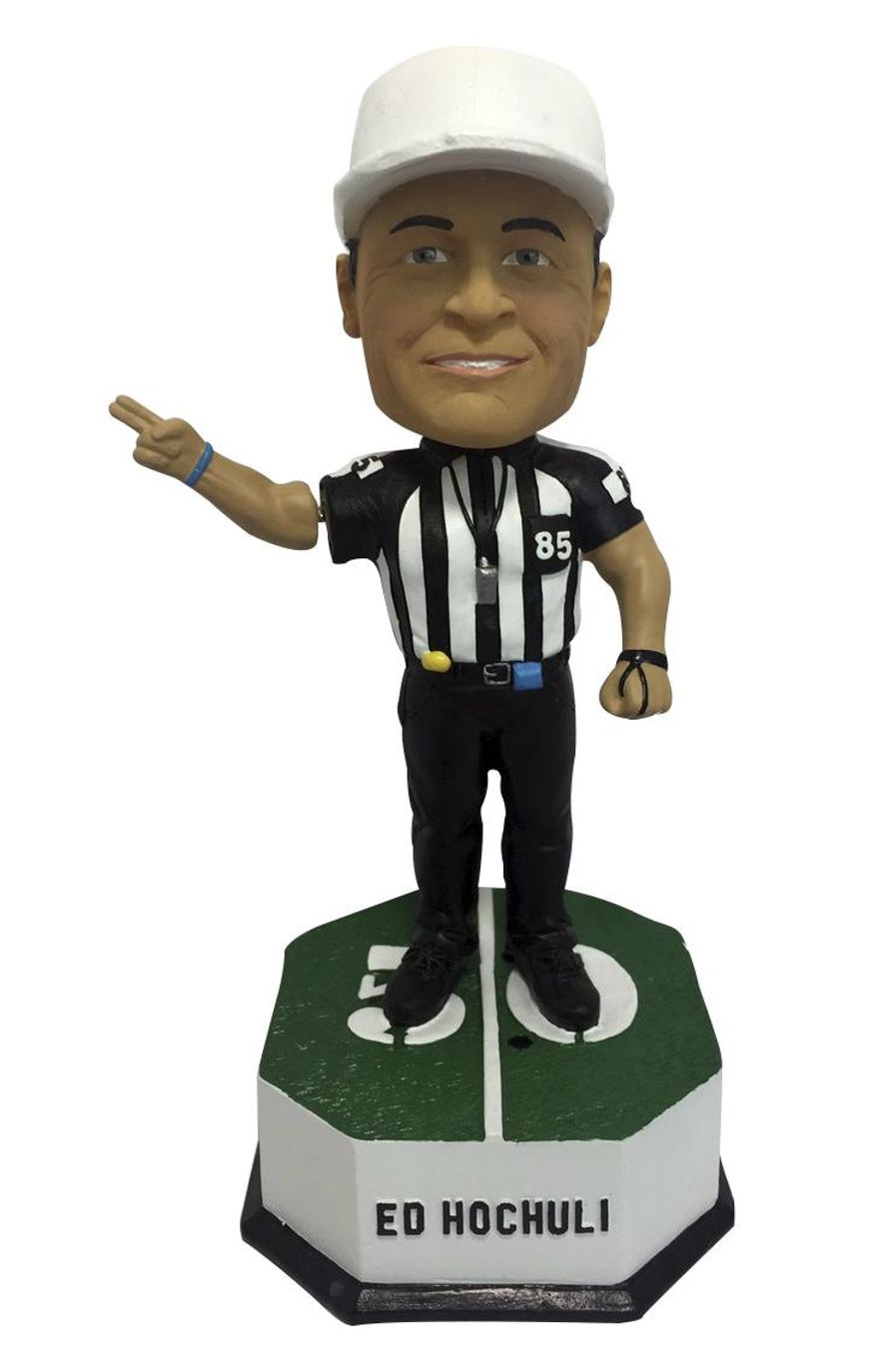 This undated photo provided by the National Bobblehead Hall of Fame and Museum, shows a bobblehead featuring former legendary NFL referee, Ed Hochuli, who retired following the 2017 NFL season. Hochuli officiated for 28 seasons in the NFL from 1990 to 2017, spending 26 of those years as a referee. (National Bobblehead Hall of Fame and Museum via AP)