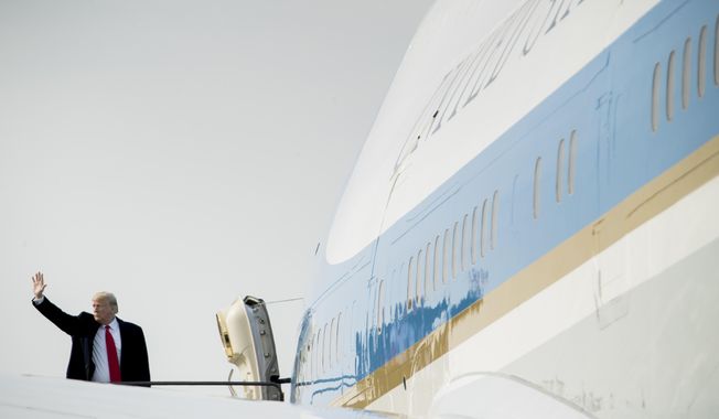 President Donald Trump boards Air Force One at Kansas City International Airport in Kansas City, Mo., Friday, Dec. 7, 2018, to travel to Andrews Air Force Base, Md., after speaking at the 2018 Project Safe Neighborhoods National Conference. (AP Photo/Andrew Harnik)