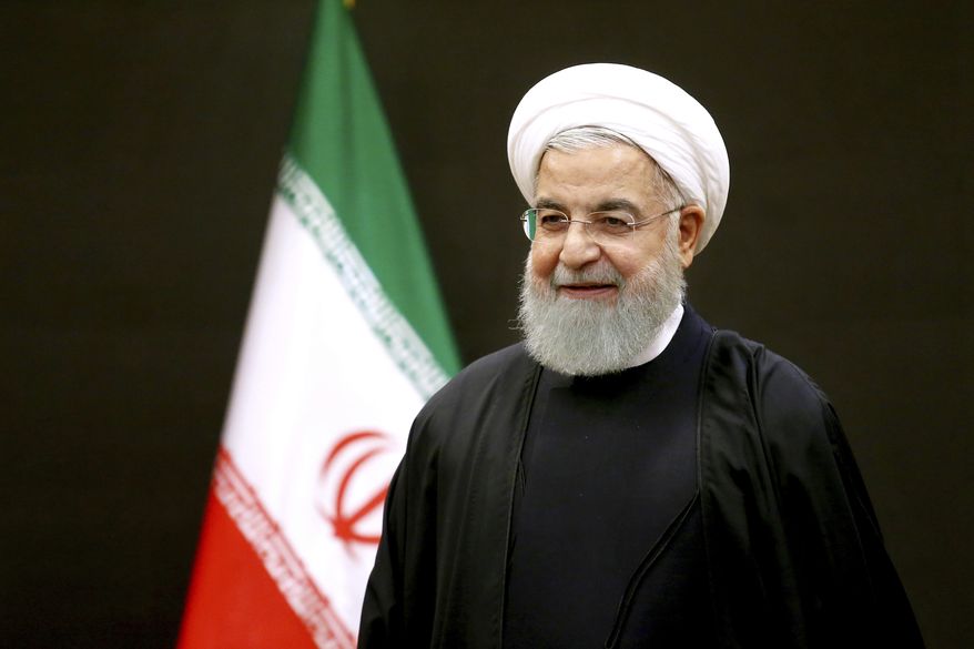 Iran's President Hassan Rouhani waits for Turkey's parliament speaker and former Prime Minister, Binali Yildirim, for their meeting, after a six-nation conference on fighting terrorism in Tehran, Iran, Saturday, Dec. 8, 2018. (AP Photo/Ebrahim Noroozi) ** FILE **
