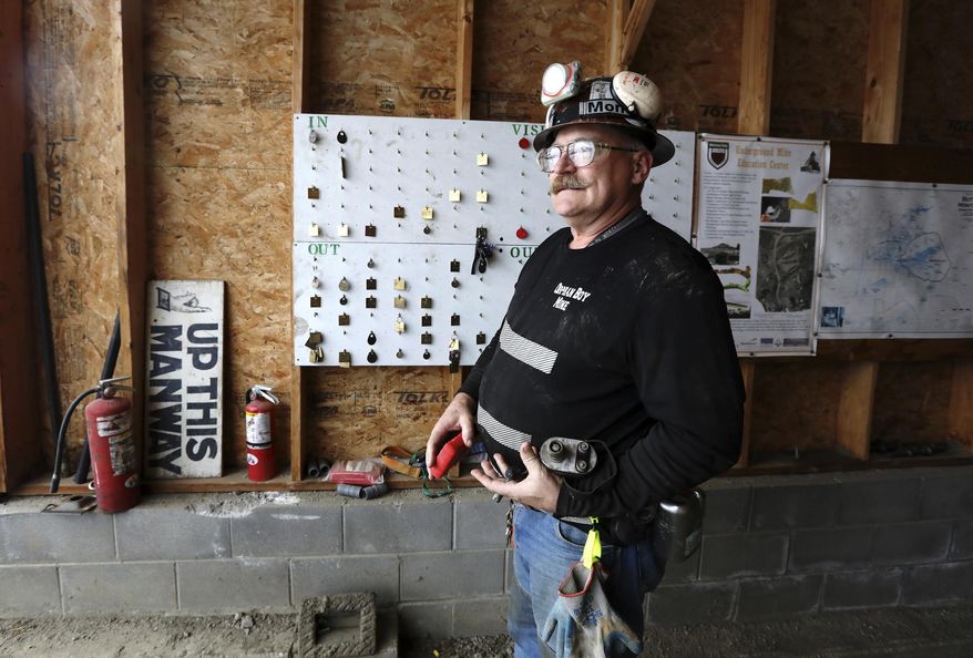 In this Nov. 28, 2018 photo, Scott Rosenthal, assistant professor and head Anaconda professor of mining engineering, stands at the entrance of the Orphan Boy mine in Butte, Mont., during a mining engineering class. The class is unique in the nation, allowing students to have a hands-on education in underground mining. (Meagan Thompson/The Montana Standard via AP)